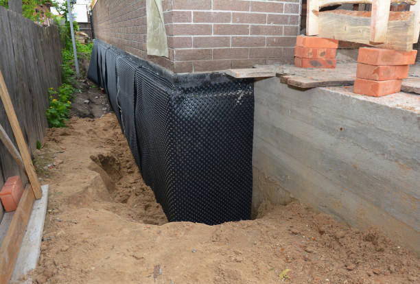SJ Waterproofing Pros technician performing targeted Exterior Waterproofing assessment in Fillmore, NY